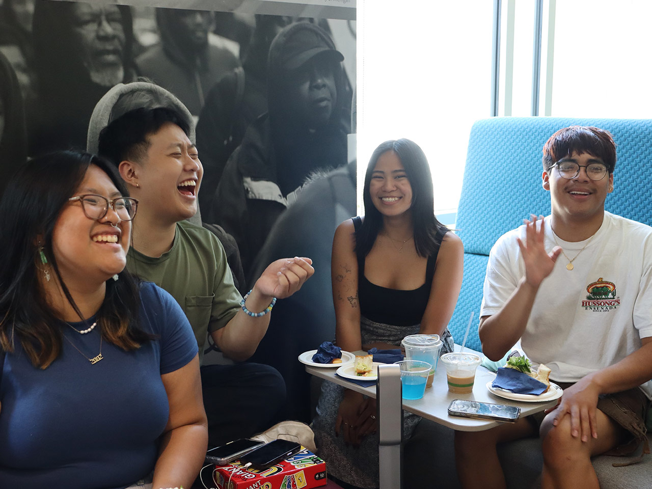 Four students laughing