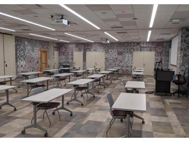 large room with tables in rows